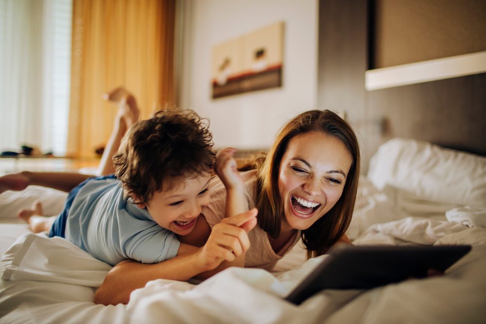 Mother and son using a digital tablet